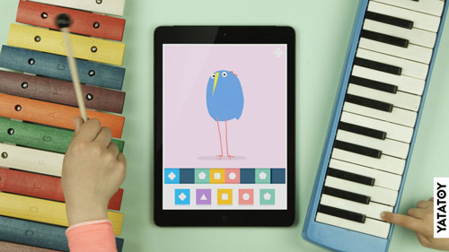 iPad and Bird and 2 Kids playing with a xylophone and a melodica along to the music